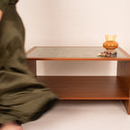 Modern wooden coffee table with tiled top in a lifestyle setting by RISA