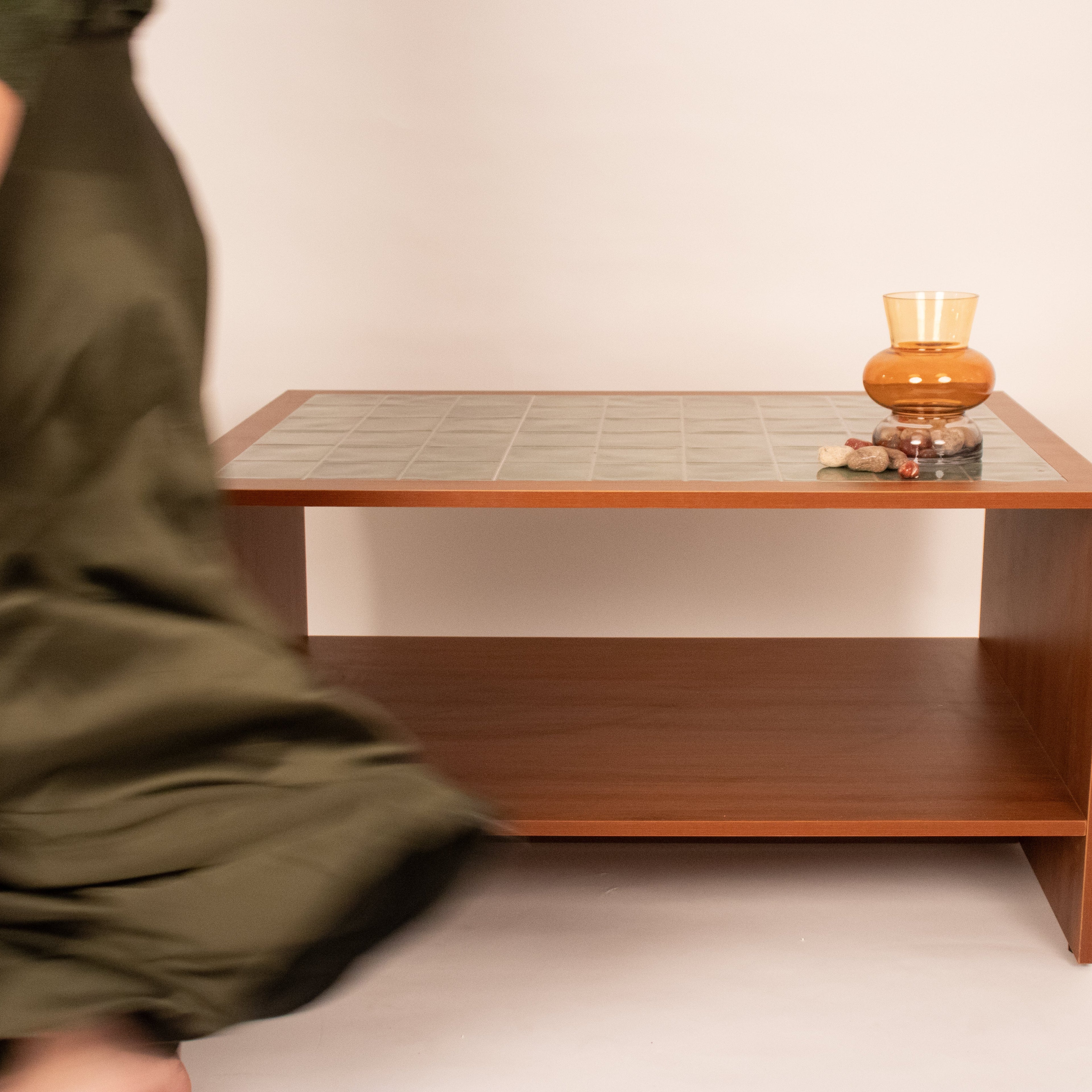 Modern wooden coffee table with tiled top in a lifestyle setting by RISA