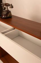 Close-up of open drawer storage in modern wooden console table by RISA