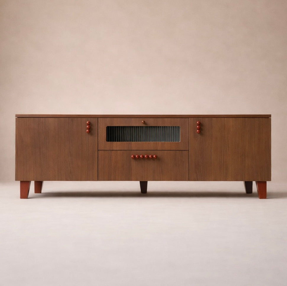 Modern wooden sideboard with red knobs and central glass panel on a beige background