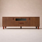 Modern wooden sideboard with red knobs and central glass panel on a beige background