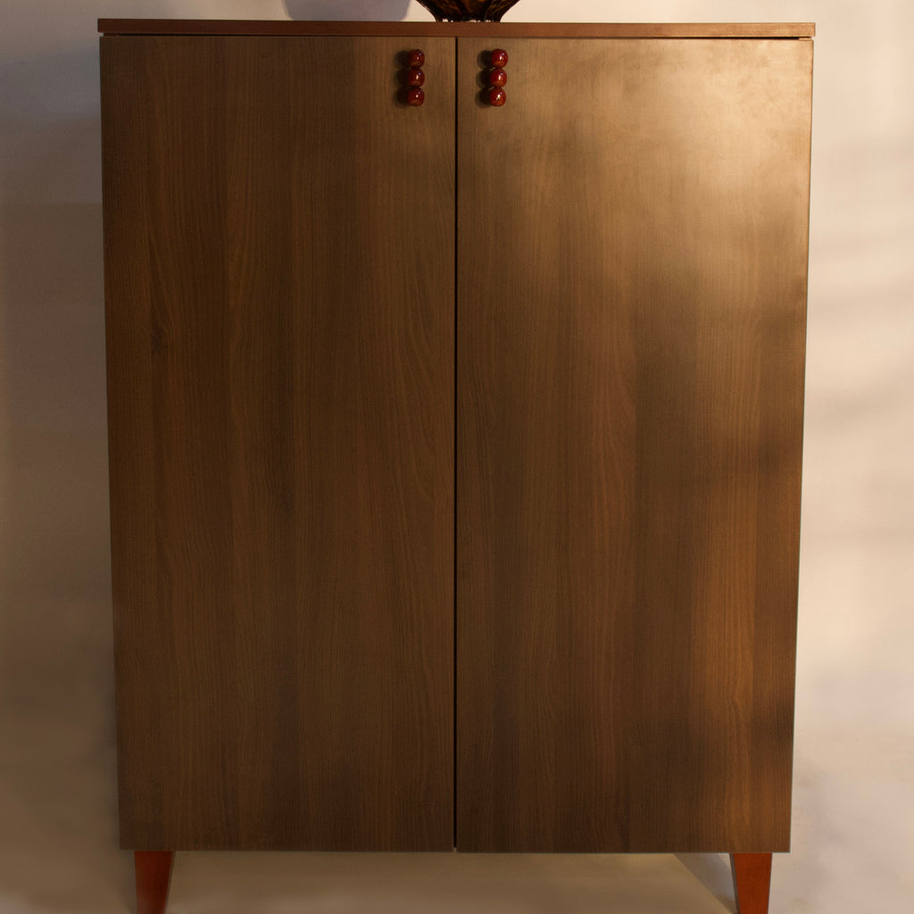 Modern wooden sideboard with two doors and red knob handles by RISA