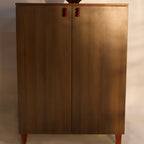 Modern wooden sideboard with two doors and red knob handles by RISA