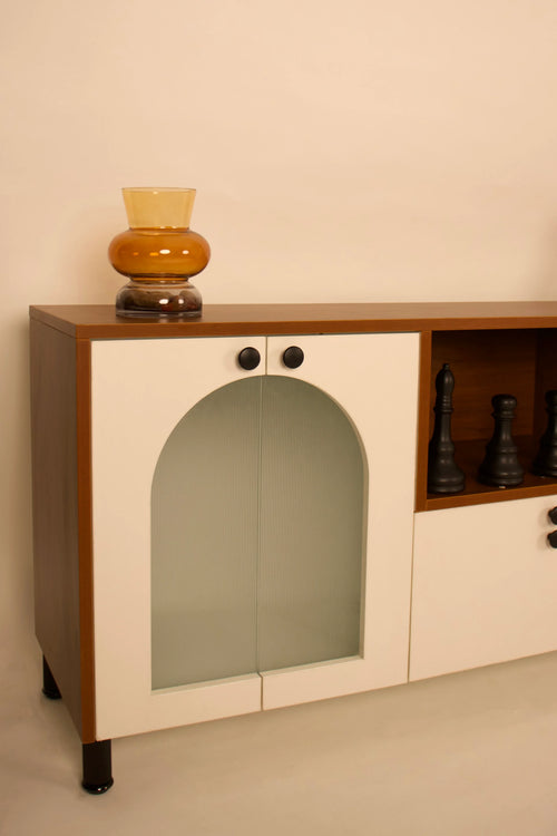 Close-up of wooden TV unit with arched glass door and storage by RISA