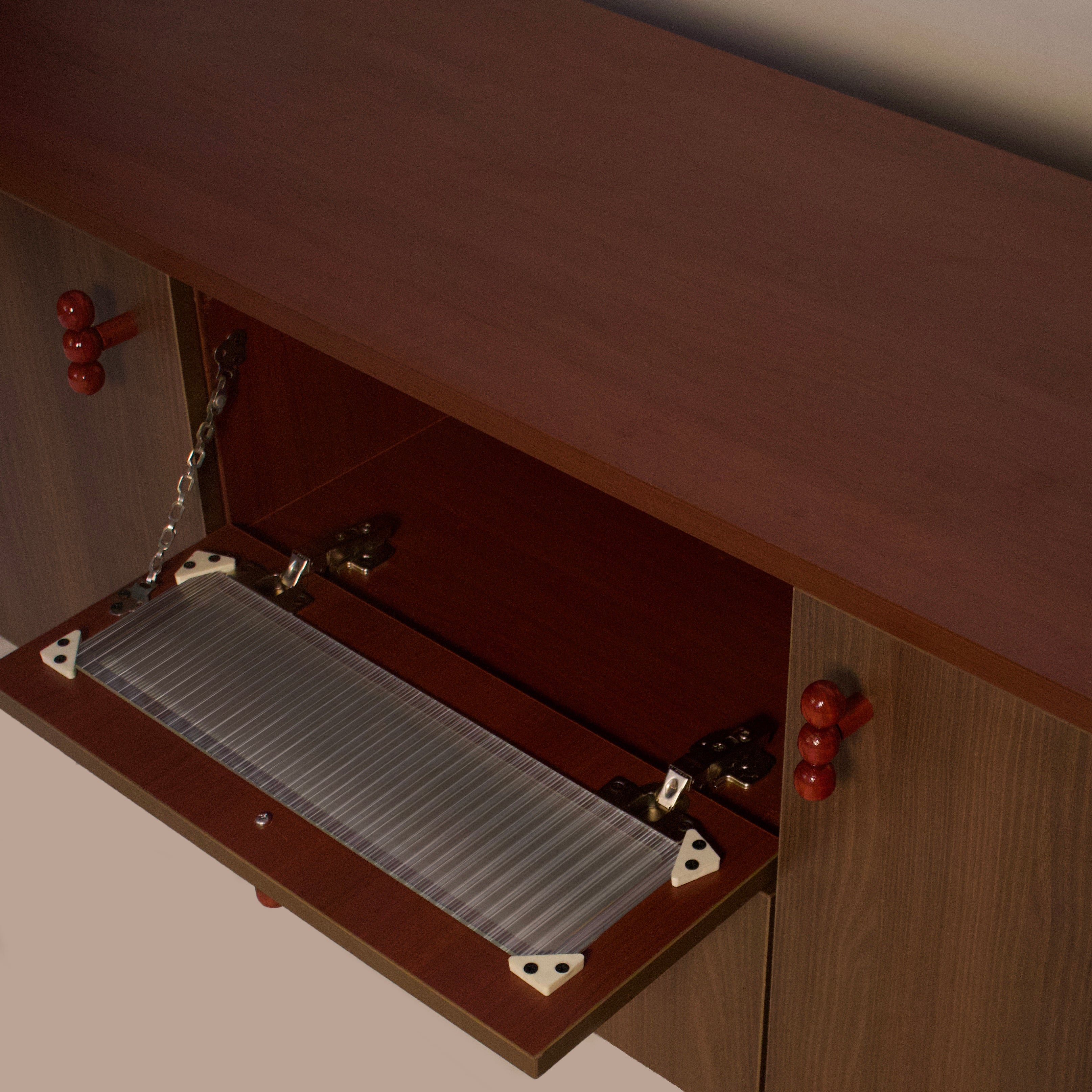risa-sideboard-fold-down-storage-glass-panel
tv-unit-flip-down-compartment-glass-detail
modern-wooden-cabinet-fold-down-shelf-feature