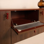 risa-tv-unit-open-storage-glass-panel-detail
wooden-sideboard-open-compartment-glass-panel-feature
modern-tv-unit-storage-detail-red-knobs-risa
