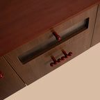 risa-sideboard-red-knob-handle-design-detail
wooden-cabinet-glass-panel-red-knobs-closeup
modern-tv-unit-design-detail-red-knobs-feature